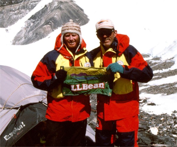 Two men standing on Mount Everest with an L.L.Bean flag.