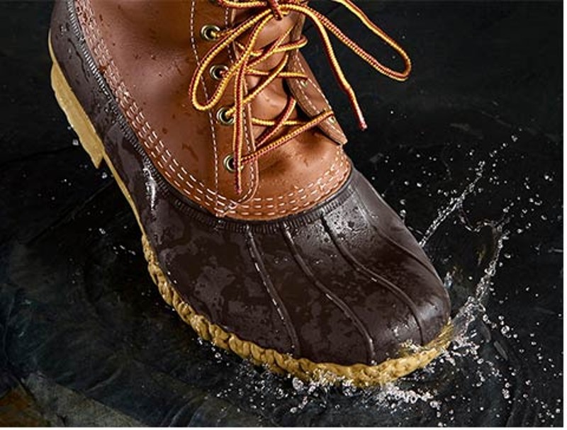 L.L.Bean Boot splashing through water.