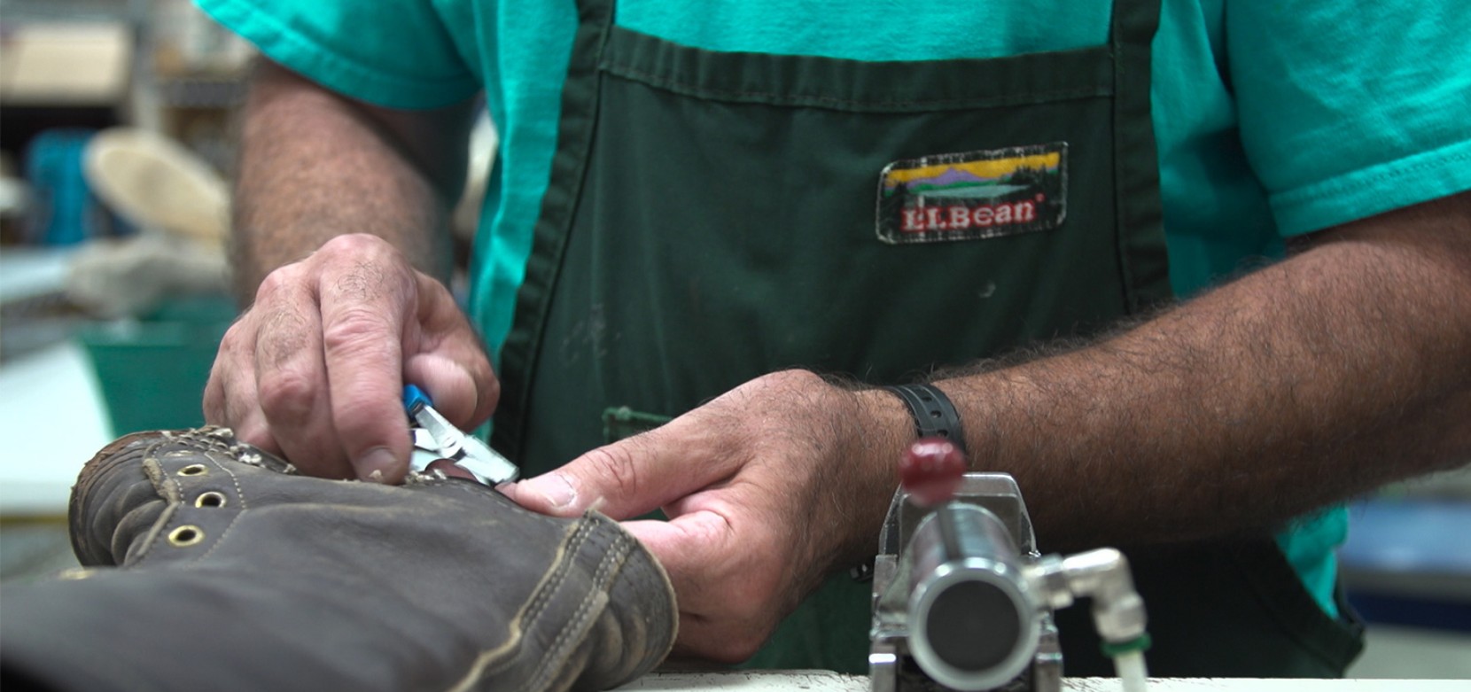 L.L.Bean Employee repairing a Bean Boot.