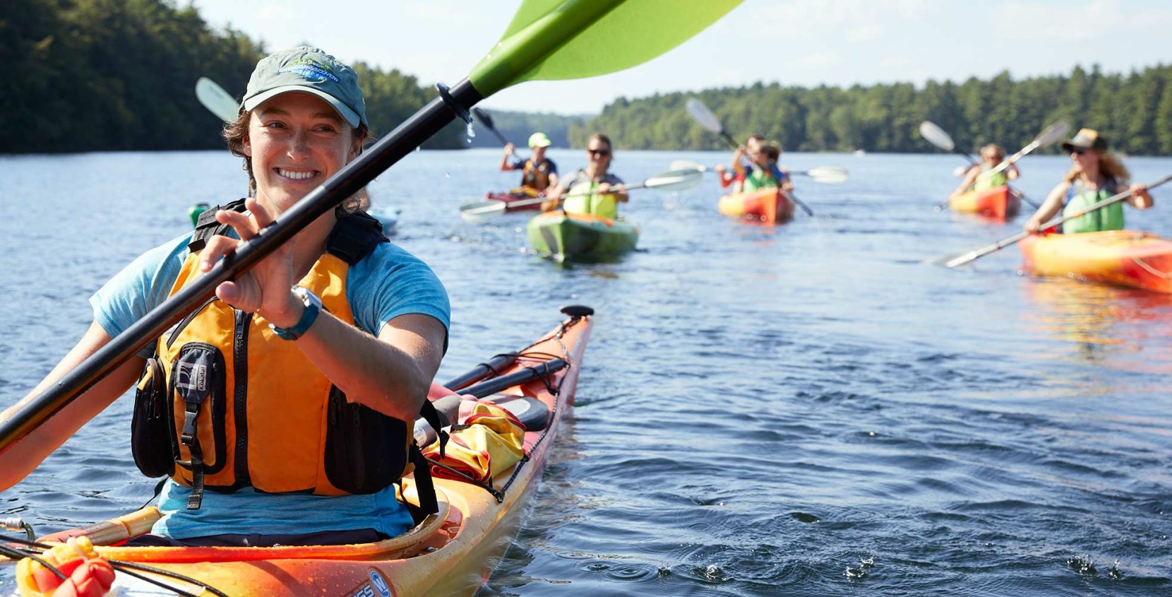 Family having fun on L.L.Bean Stand Up Paddle Boards