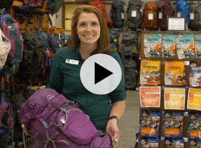 An L. L. Bean Customer Service Rep holding a hiking pack, and a play video symbol.