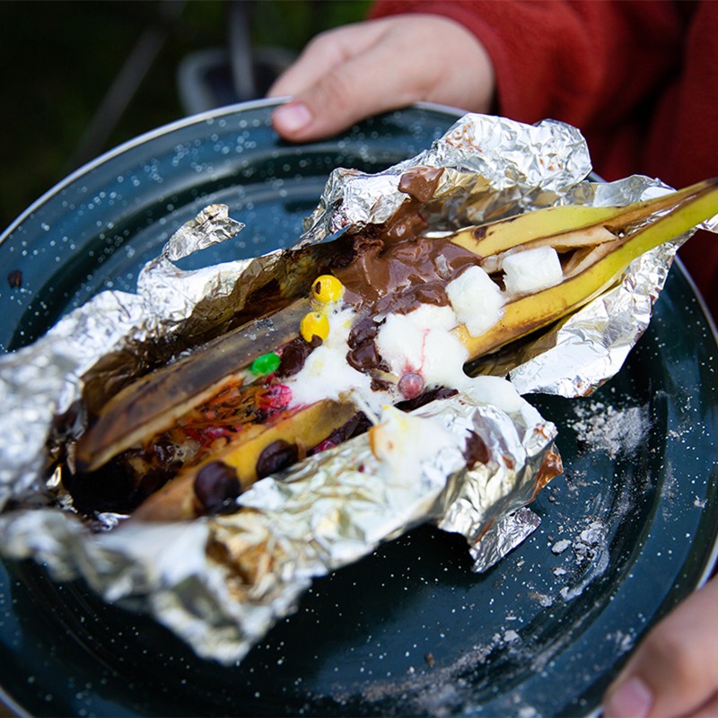 Close-up of a finished banana boat fresh off the camp stove