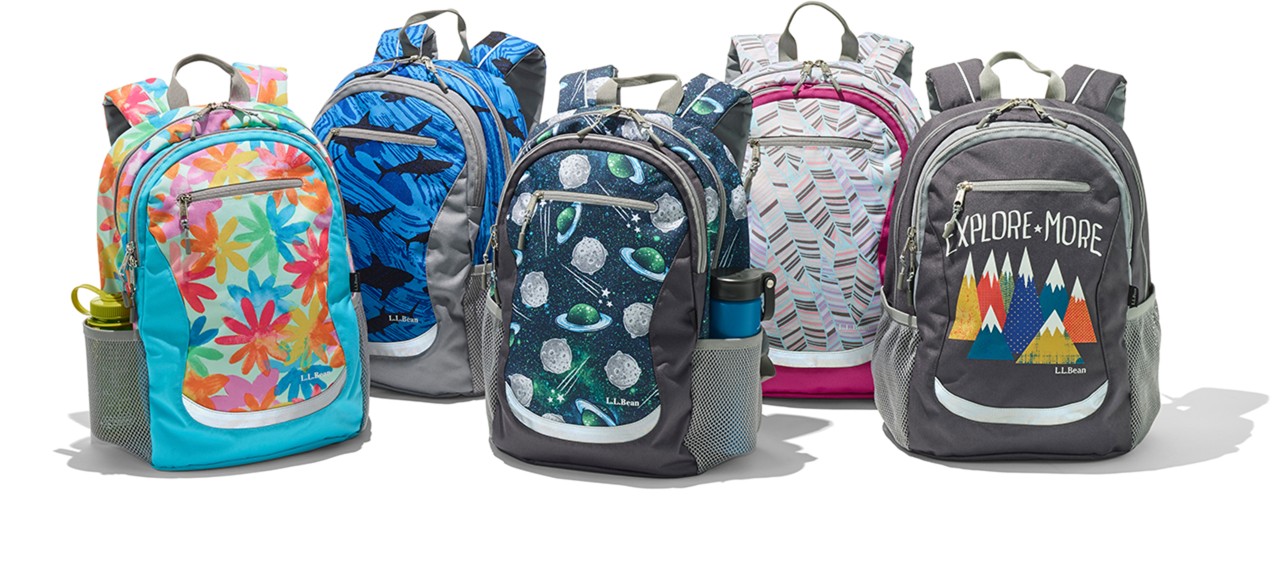A line-up of 5 school backpacks.