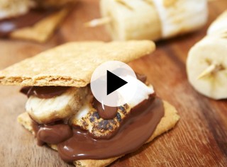 A yummy s'more with melted chocolate.
