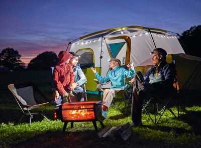 Happy family camping at twilight with L.L.Bean gear