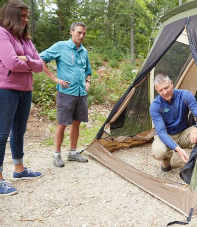 Photo of a family setting up a tent.