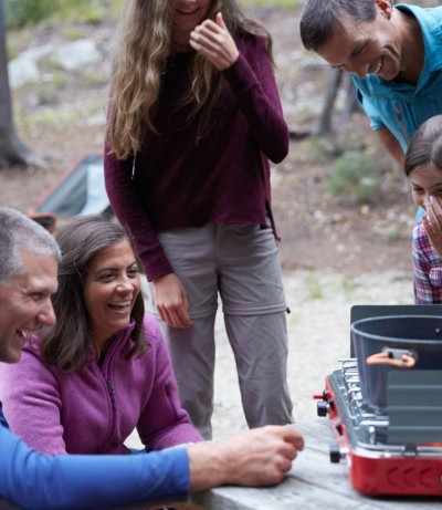 Photo of a family grilling at camp.