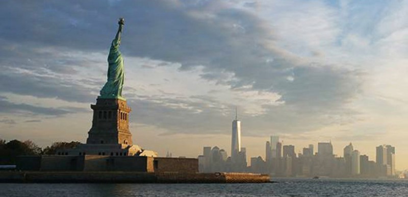 New York skyline and the Statue of Liberty.