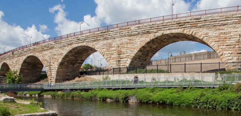 A stone bridge and a river.