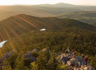 group of hikers at sunrise