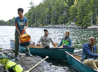 4 friends canoe camping