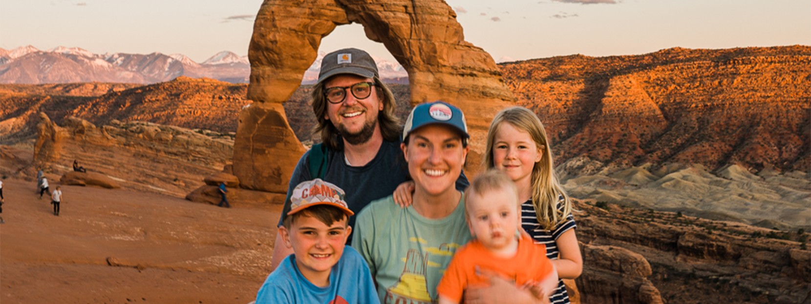 The Bowman Family posing in front of a rock formation.