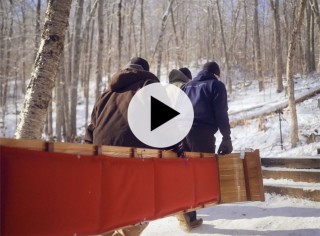 three men and a toboggan