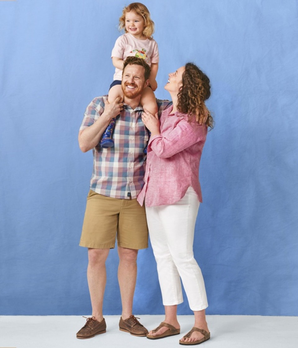 Julie, Leon and Anouk Benn. Anouk is on Leon's shoulders, Julie is smiling up at Anouk.
