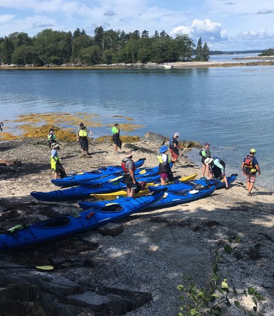 Photo of people kayaking.
