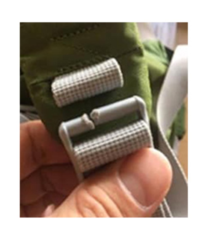 Close-up of a split buckle on the Osprey AG Plus Child Carrier.