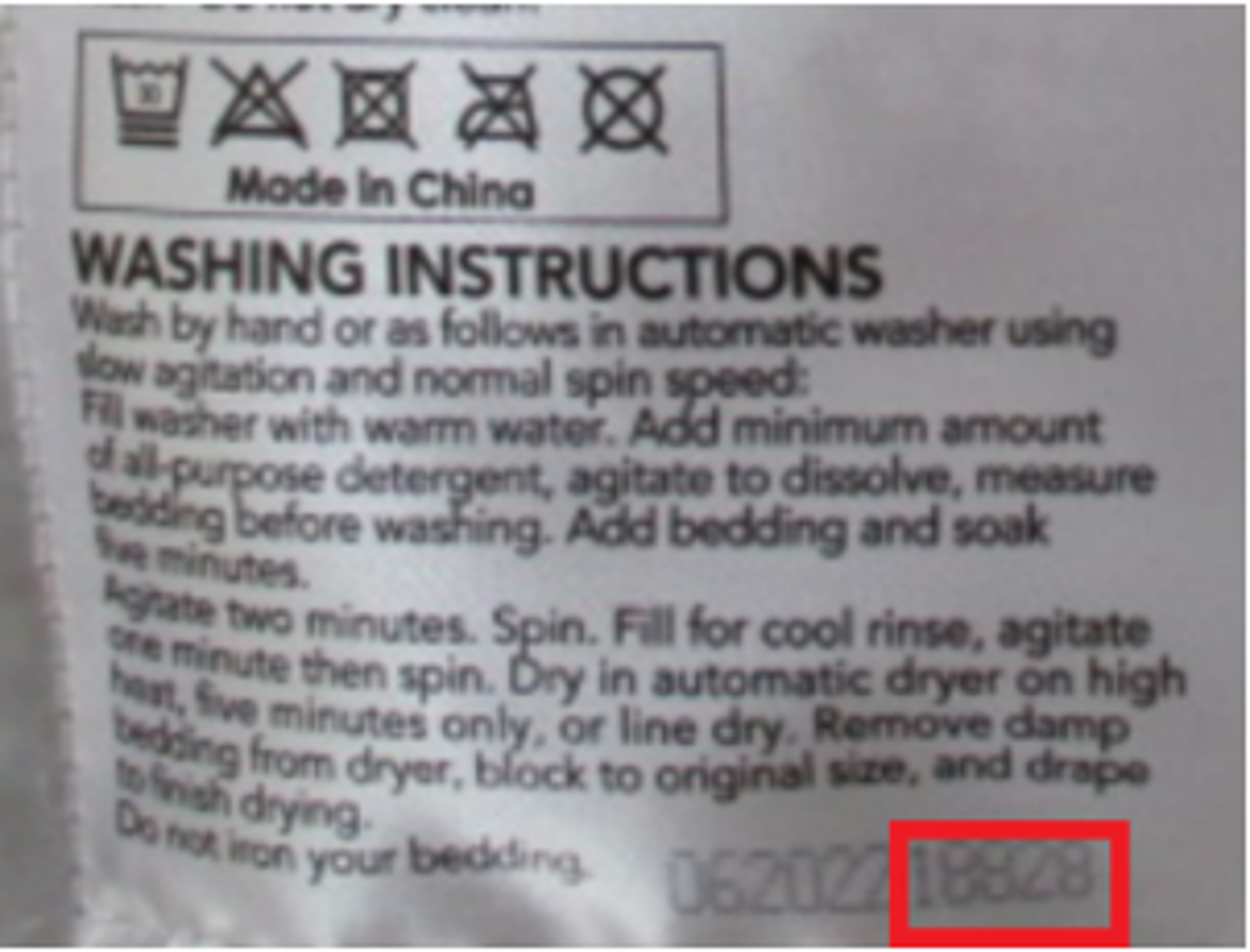 Berkshire blanket washing instructions tag with the last 5 digits of the tracker number outlined in red.