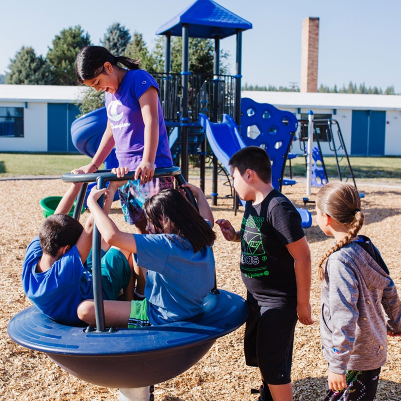 Kids playing on a playground.