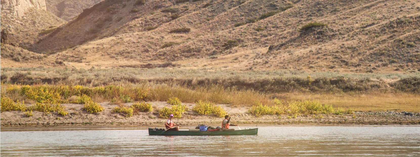 2 men in a canoe on the Upper Missouri River.