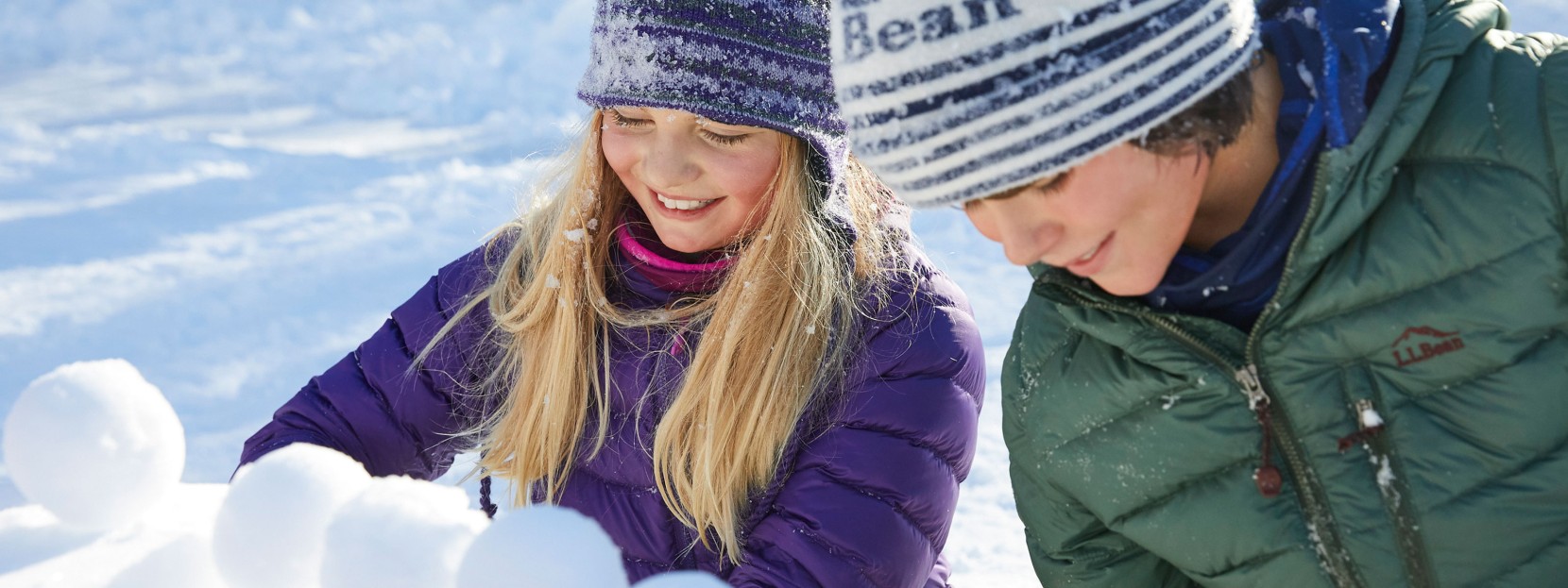 Two children making snowballs