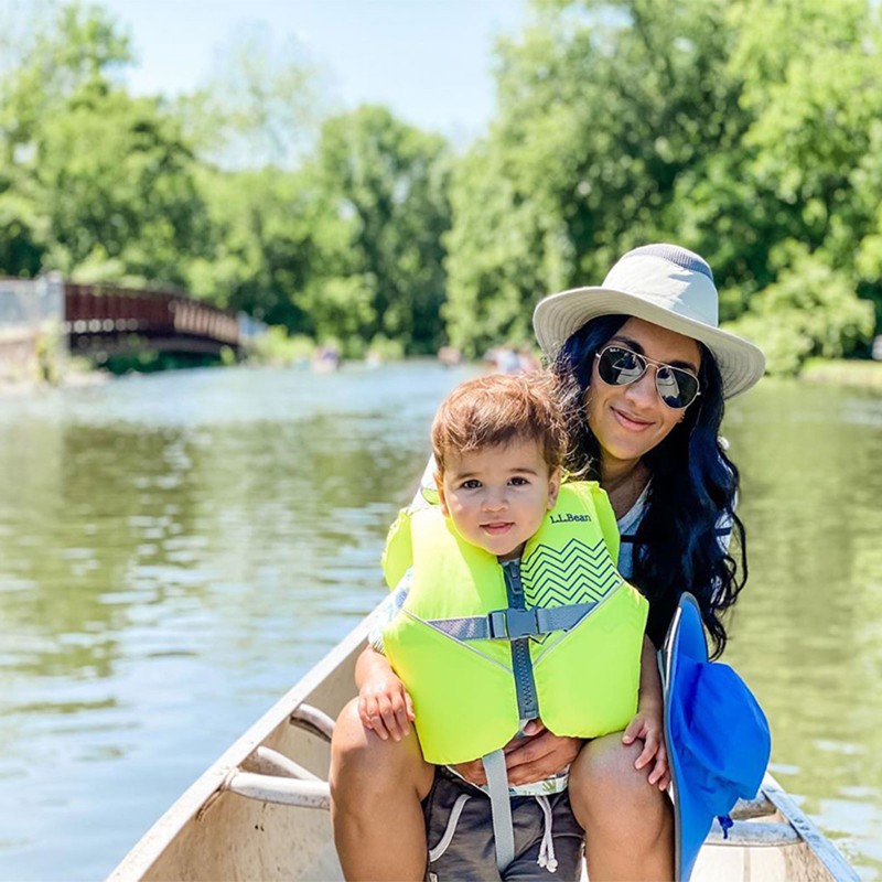 A mother and child in a canoe.