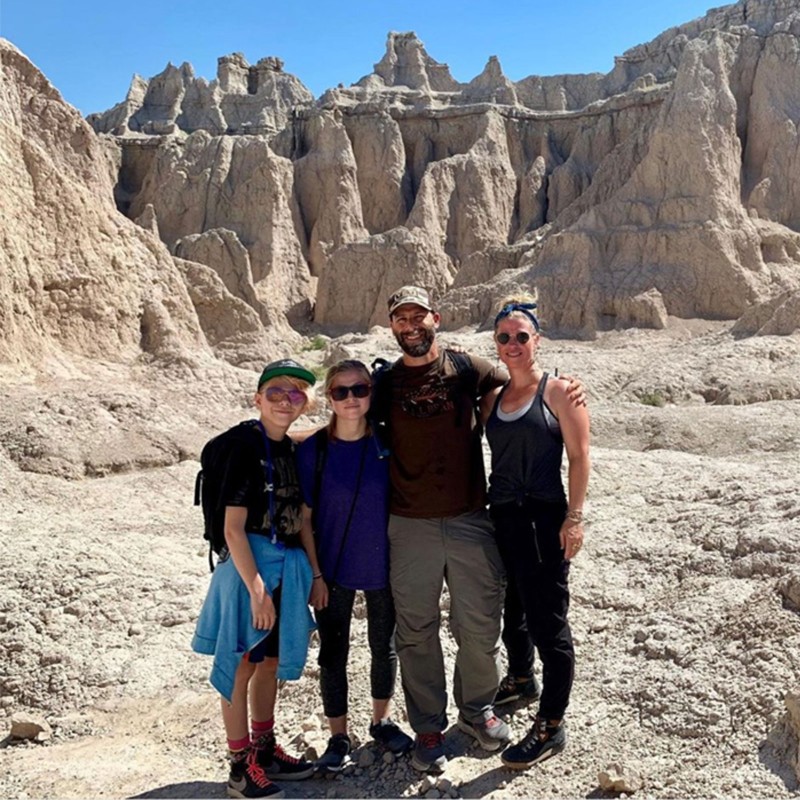 Dan Tarkinson and his family, beautiful rock formations in the background.