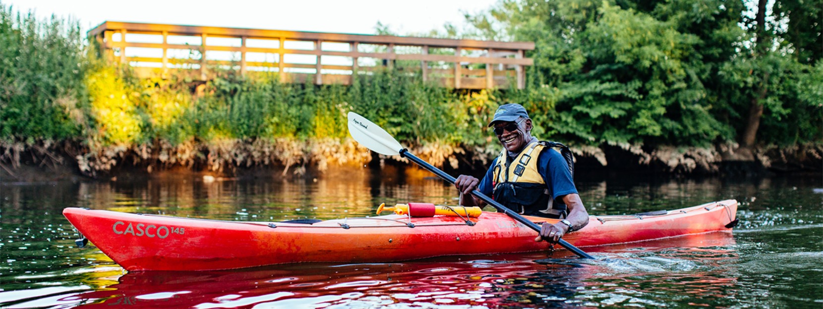 Forrest Mayo paddling in a red kayak.