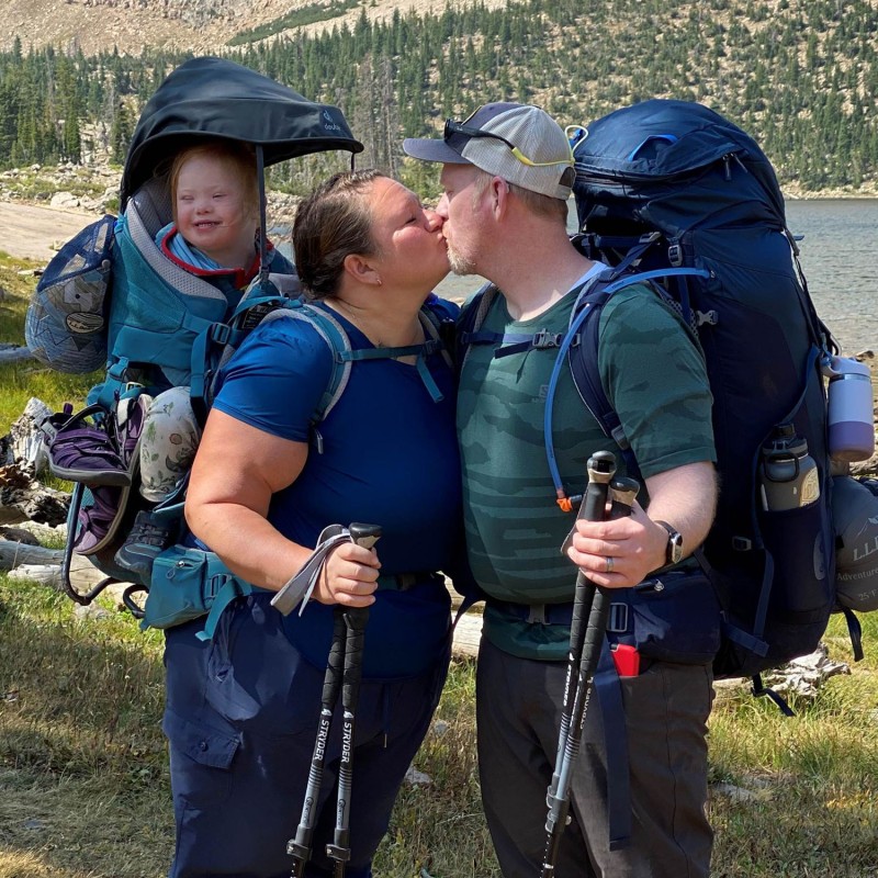 Melody Forsyth and her husband sharing a kiss on the trail.
