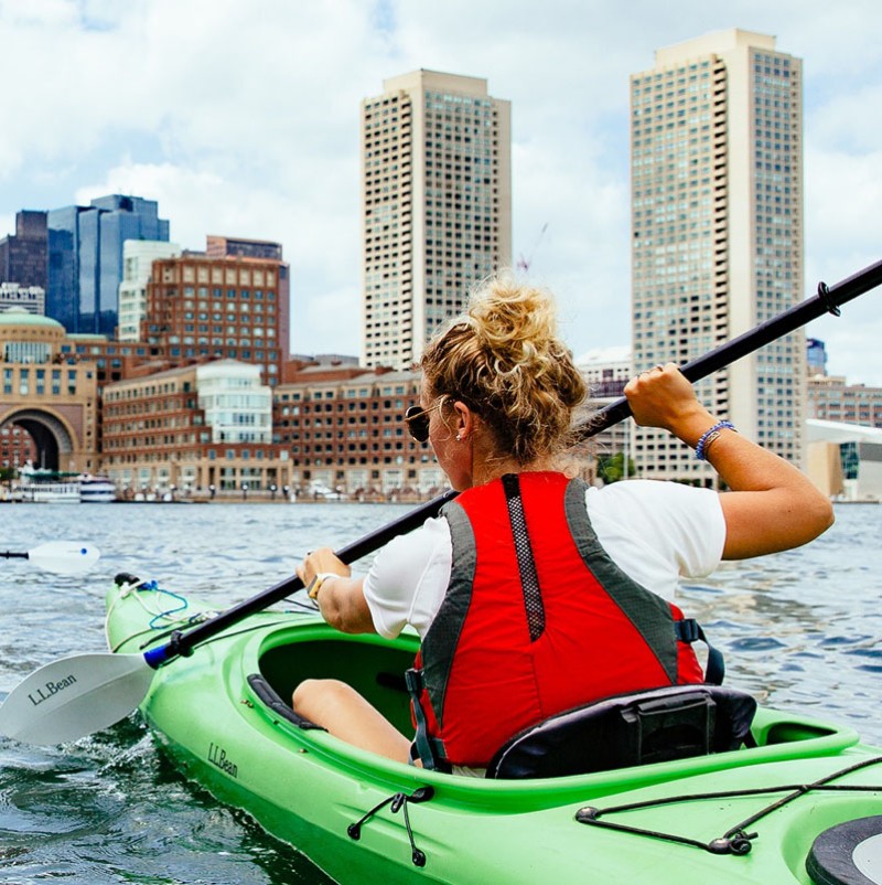 A kayaker paddling in Boston Harbor.