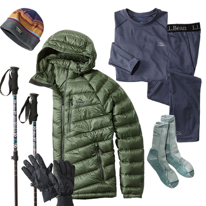 An overhead view of several important winter layers including socks, long underwear, gloves, hat and jacket.