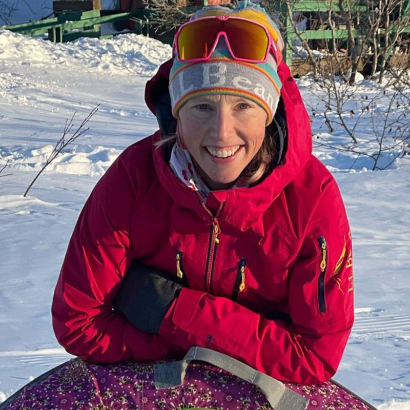 L.L.Bean Ambassador Kikkan Randall smiles for the camera outside on a bright winter day.