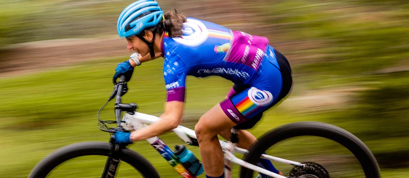 Lea Davison riding fast on her mountain bike.