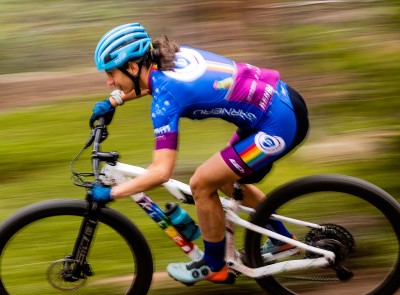 Lea Davison riding fast on her mountain bike.