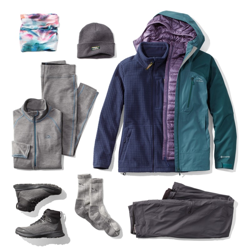 A laydown of clothing needed for hiking in cold weather.