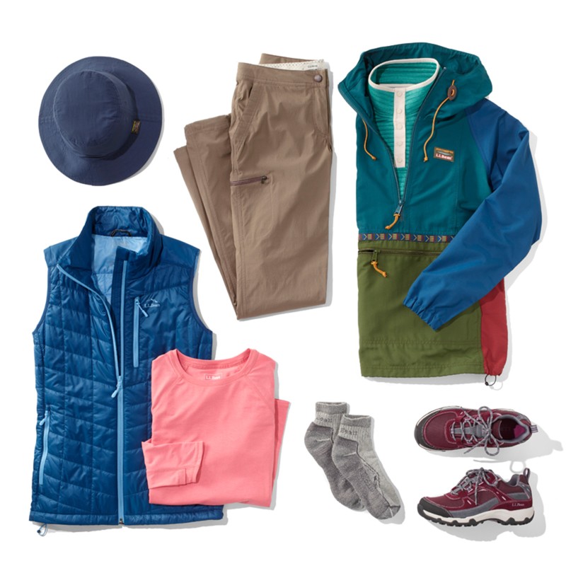 A laydown of clothing needed for hiking in mild weather.