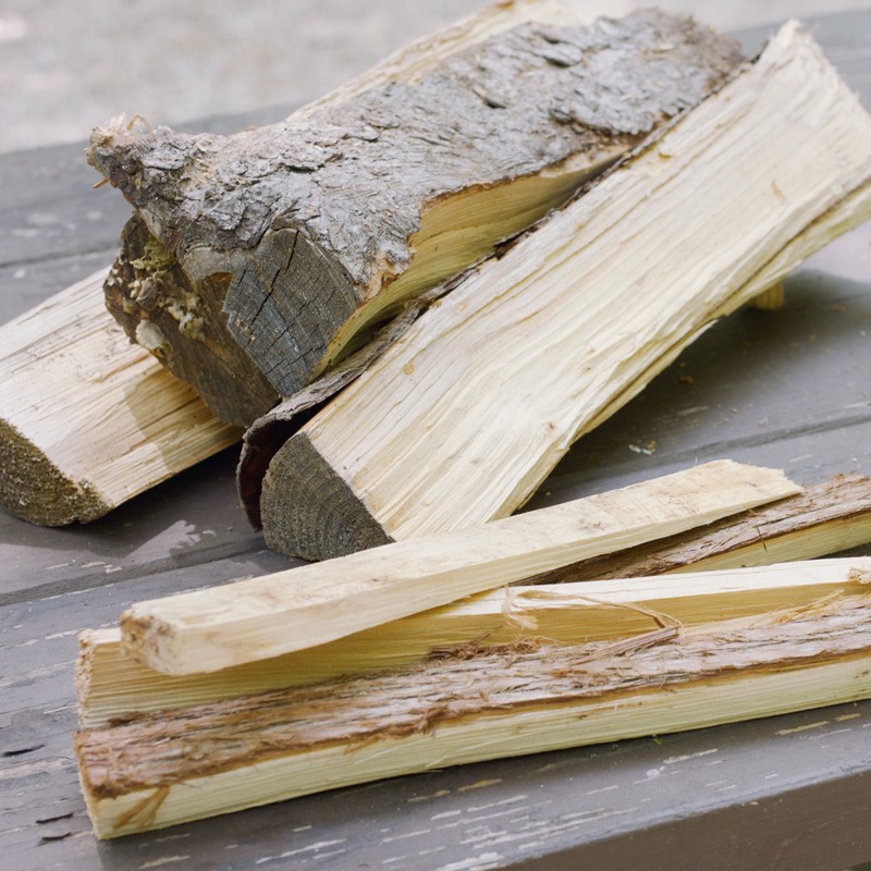 A few medium-sized split logs and a few pieces of smaller, kindling-sized wood.