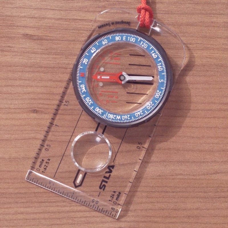 A compass with its needle pointing North, which is magnetic north.