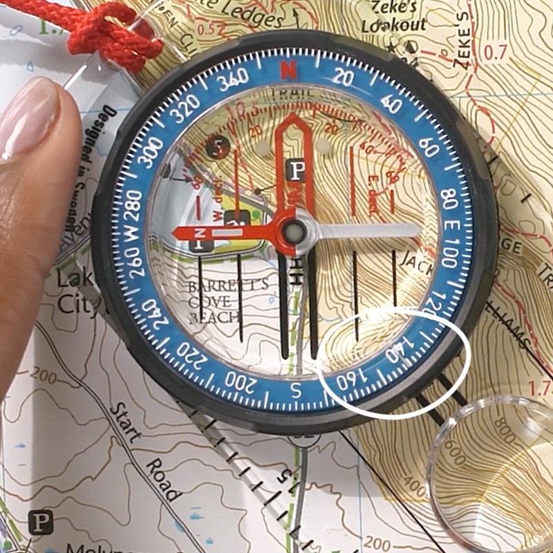The same image of compass on map with white circle around the reading "141."