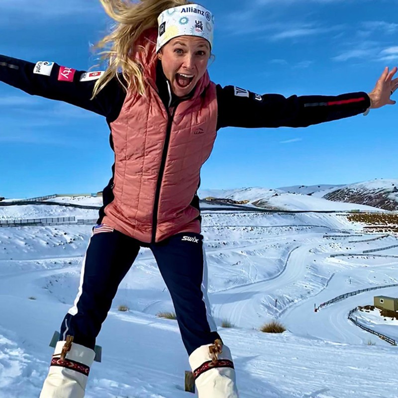 Jessie jumping with snow in the background