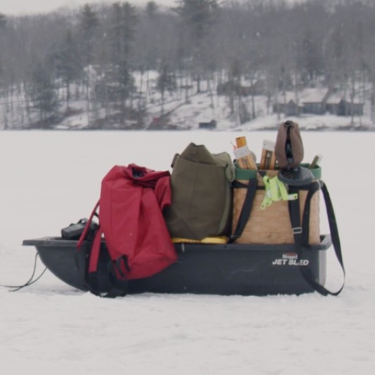 A sled filled with gear on the ice.