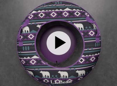 An overhead view of a purple patterened L L Bean sonic snow tube with a play video icon in the middle.