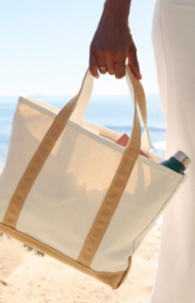 Image of a woman carrying a tote bag