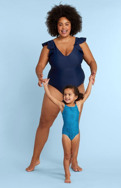 Image of a woman and a small child wearing swimsuits.