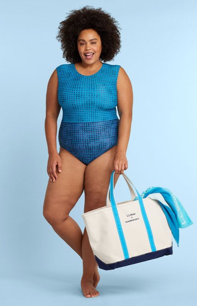 Image of a woman wearing a swimsuit carrying a Boat and Tote bag.