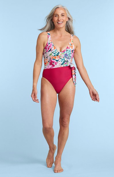 Image of a woman wearing a pink swimsuit.