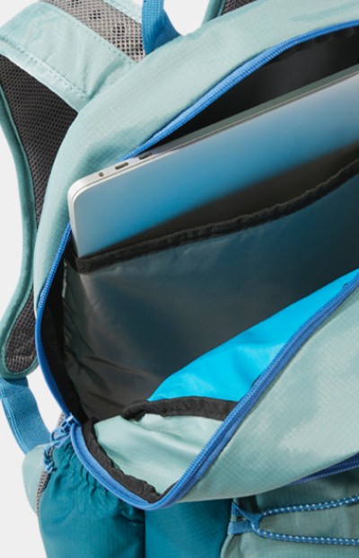 Close-up of laptop in an unzipped school backpack.