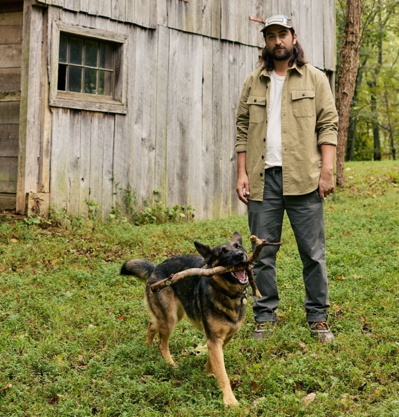 Noah Kahan outside with his dog Penny.