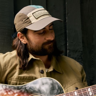 Noah Kahan wearing an L.L.Bean & Noah Kahan 5-panel hat.