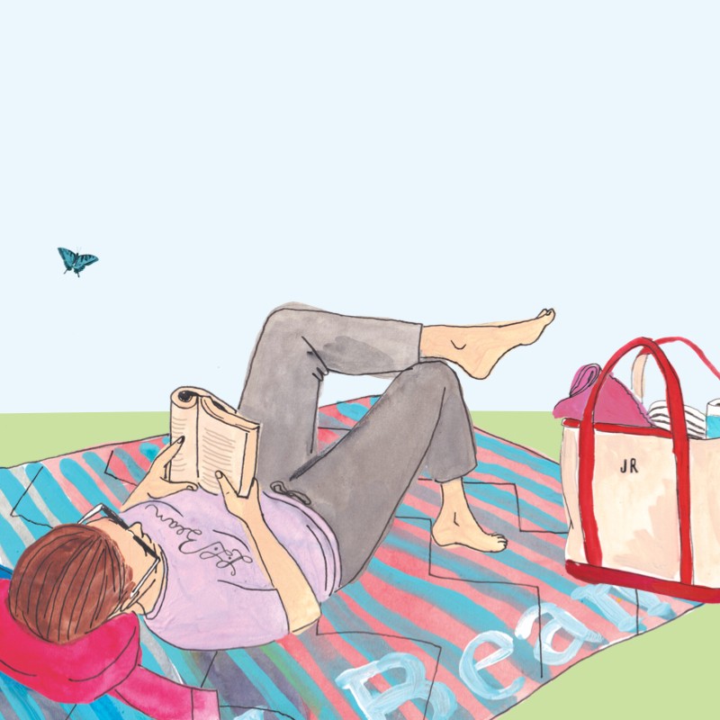 Illustration of a woman outside lying on a blanket reading, a full Boat & Tote beside her and a rabbit in the grass nearby.