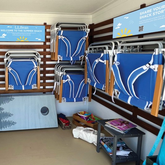 The inside of a Summer Shack with beach chairs, games and other gear.